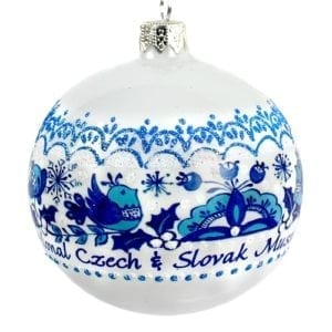 white and blue round glass ornament with bird and flower motifs